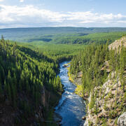 A river flows through a canyon into the distance.
