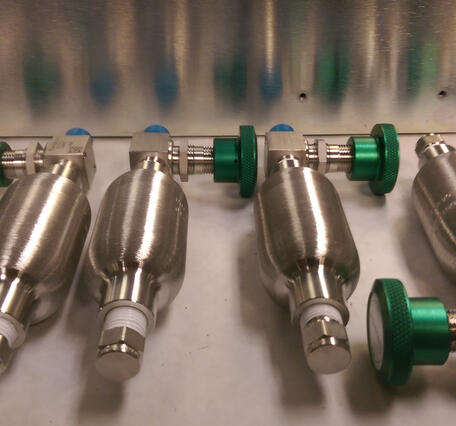 A series of silver gas cylinders