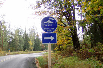 Volcano Evacuation Route sign along a roadway in Washington State. ...
